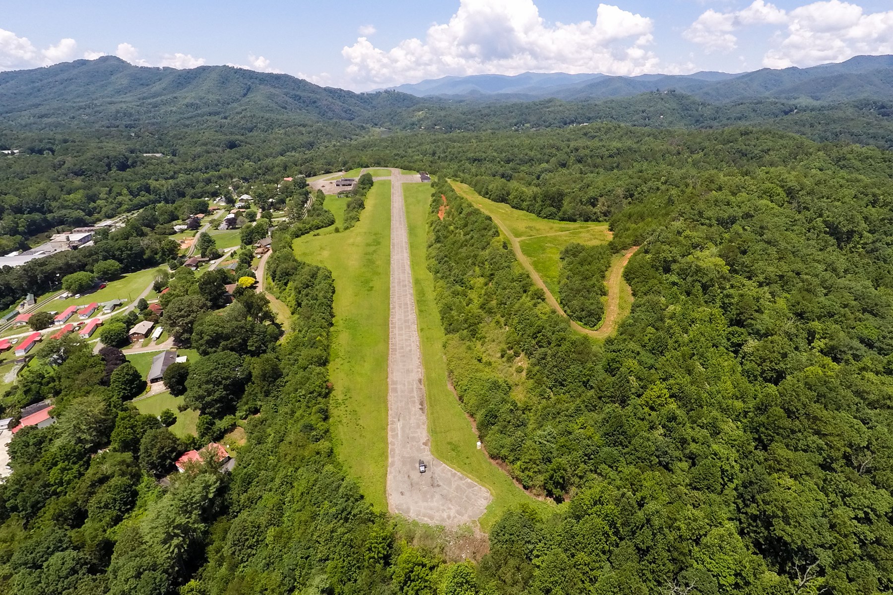 This ~104 acre tract is in an opportunity zone. Includes ~60 acres located within city limits and ~70 acres of ridgeline watershed forest. Airstrip overlooks Bryson City and the Tuckasegee River.