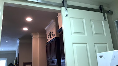 Ever thought of using a Barn Door in your Utility Room?