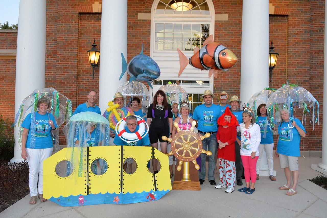 The Greentree Festival committee dressed up in costumes posing outside city hall.