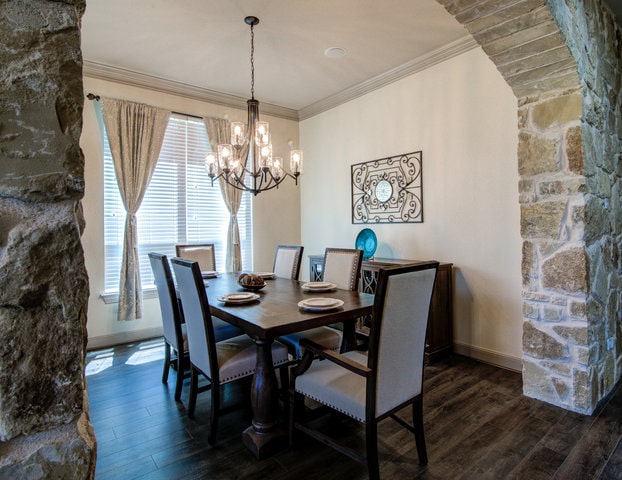 image of formal dining with stone arch real estate photography austin