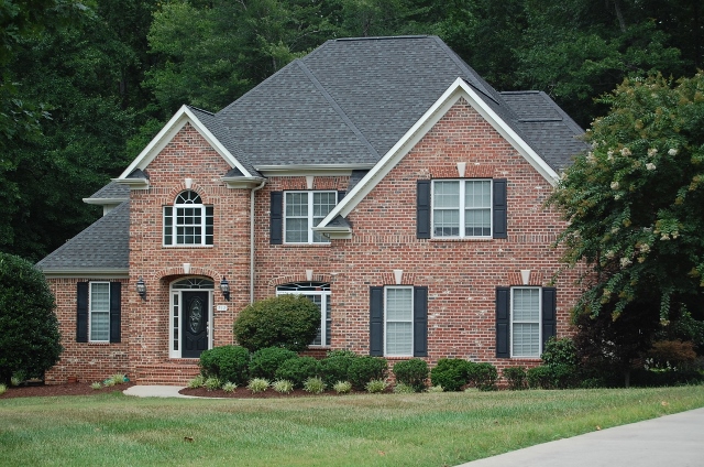 RIDGE EXECUTIVE HOME ON A PRIVATE WOODED LOT