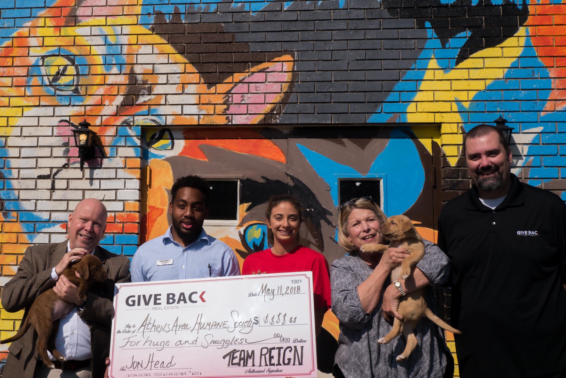 Jon Head makes a donation to Athens Area Humane Society