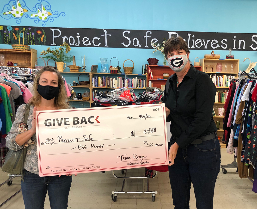 Deanna Brooks presents a GIVE BACK to Project Safe for TEAM REIGN