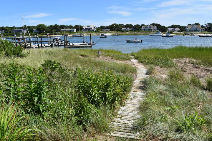 A pathaway leading to the waterfront along the Bass River in Cape Cod MA