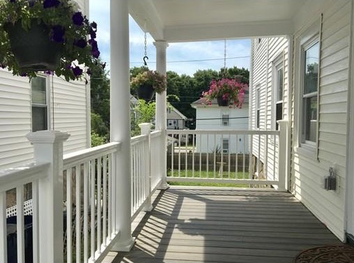A beautiful porch with flowers, one of the most expensive apartments available to rent in Roslindale, Boston MA