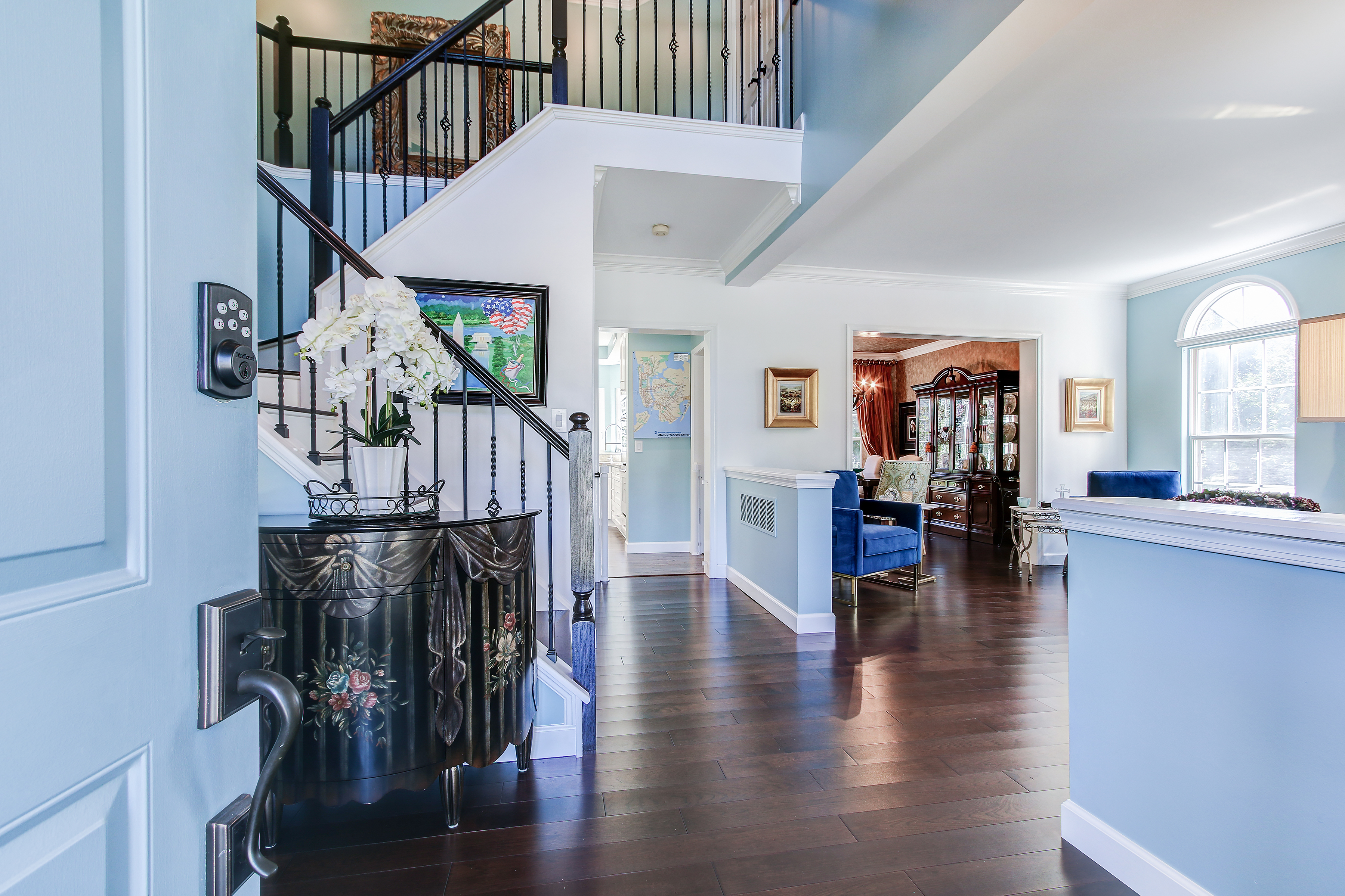 Sitting room, gleaming hardwoods, and incredible craftsmanship throughout the main level.